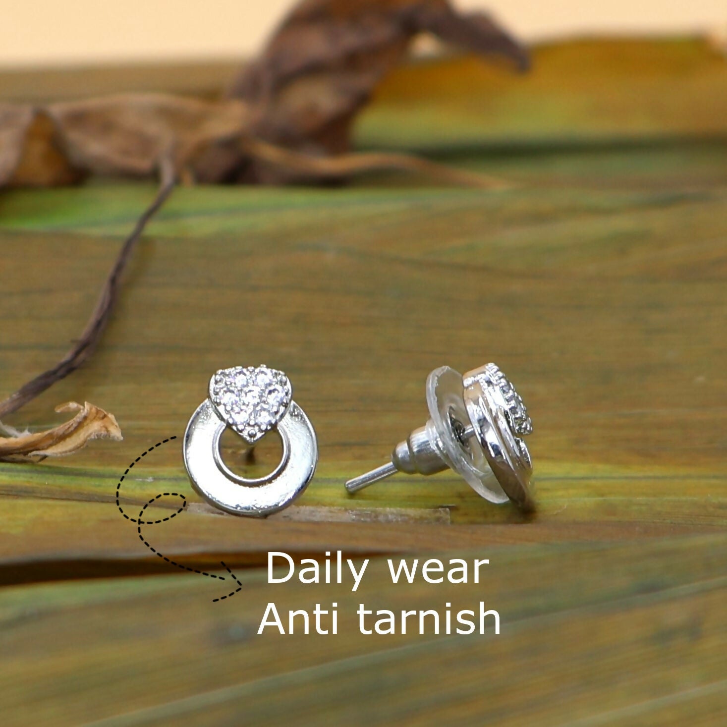 Elegant silver tone heart stud earrings designed for women and girls
