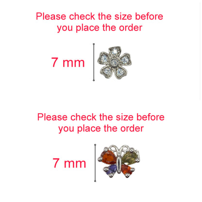Flower and butterfly stud earrings worn on ear showcasing dainty design