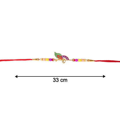 Festive rakhi featuring bird-inspired centerpiece and thread