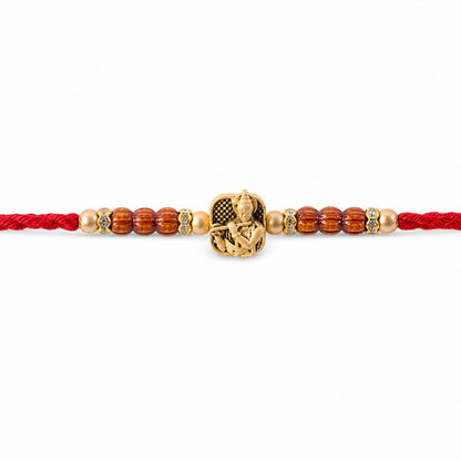 Red Beaded Rakhi with Antique Gold Krishna Charm and Wooden Beads