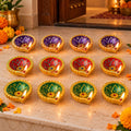 Decorative Painted Clay Diyas with Lotus Motifs and Gold-Tone Rims (12 Pc)