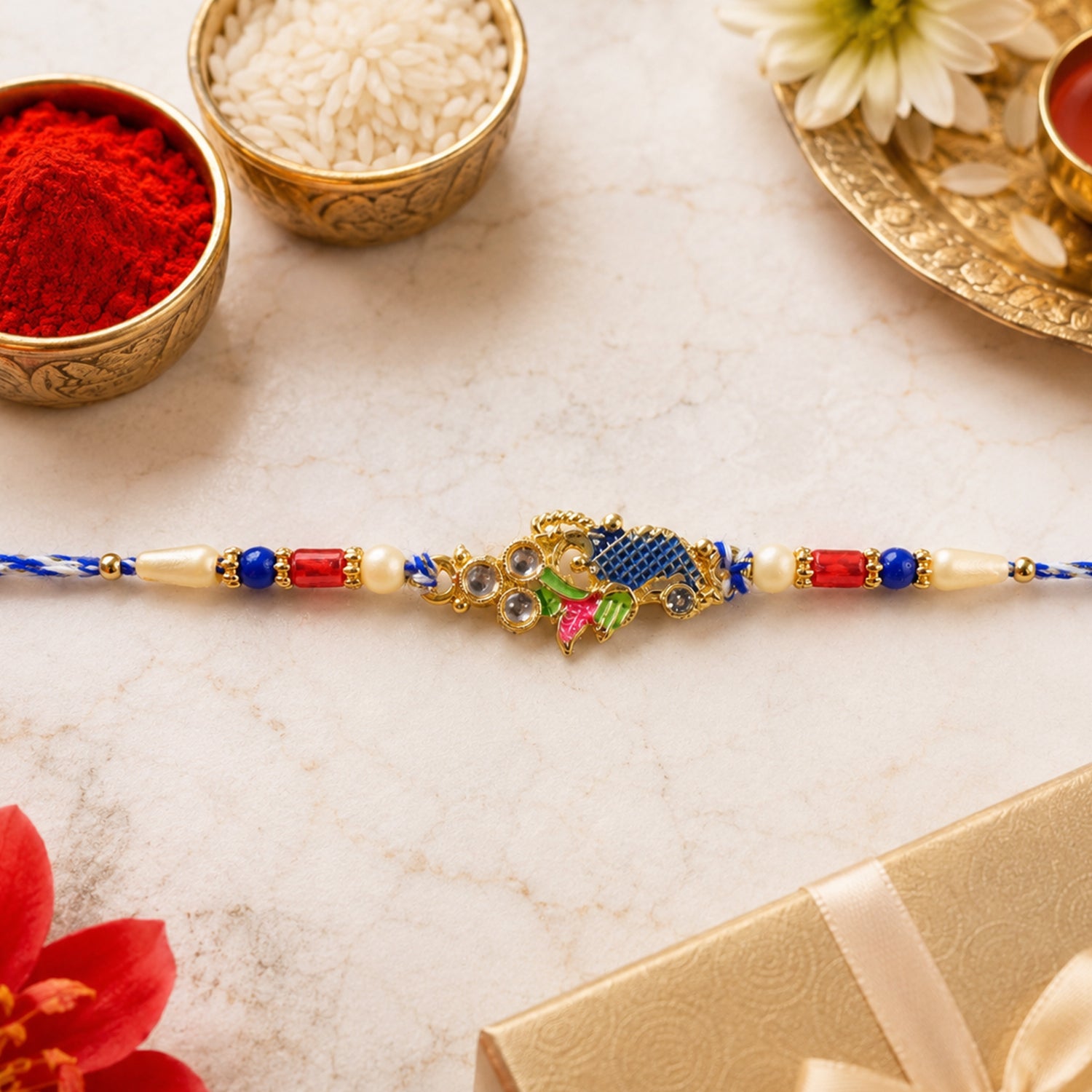Peacock Motif Rakhi with Red Blue Beads and Elegant Traditional Gift Presentation