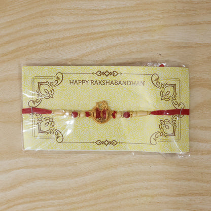 Golden Damru Om Rakhi for Boys with Red and White Beads