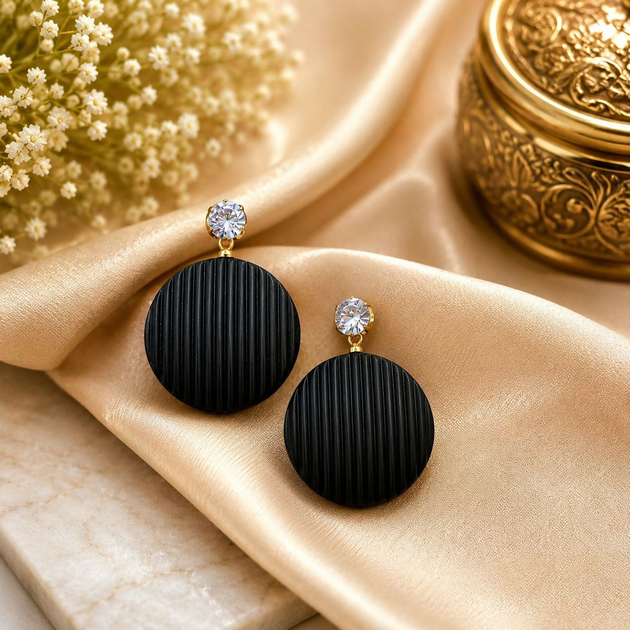 Close up view of the 12 pairs of colorful round drop earrings, highlighting their diverse designs and crystal embellishments.