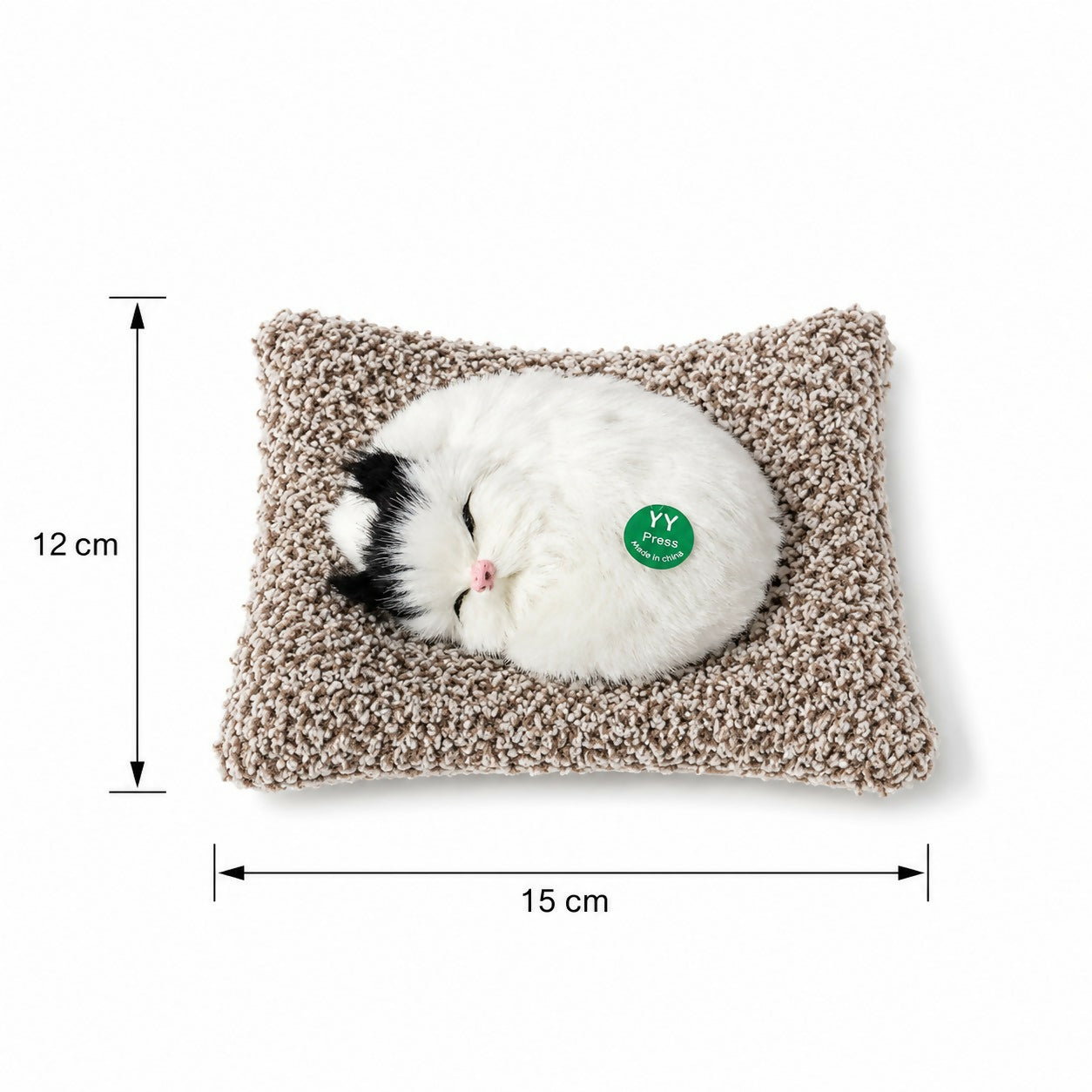 Fluffy cat plush toy placed on shelf as home decoration