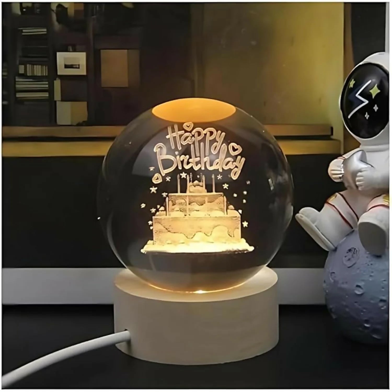 Close-up of Happy Birthday 3D LED crystal ball lamp glowing
