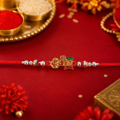 Mahadev Damru Rakhi with Red Green Beads and Pearl Highlights