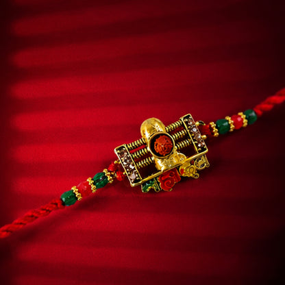 Traditional Shivling Rudraksha Rakhi with Red & Green Beads