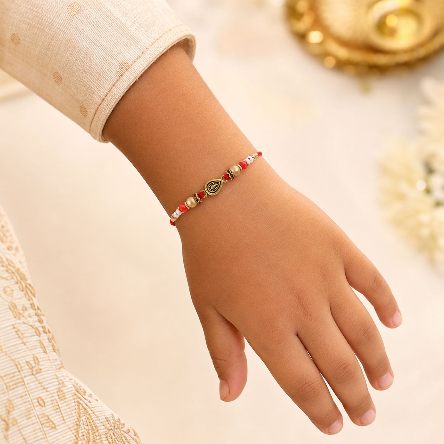 Graceful Teardrop Eye Bhai Bhabhi Rakhi with Drop Pendant and Pearl Tassel for Gift