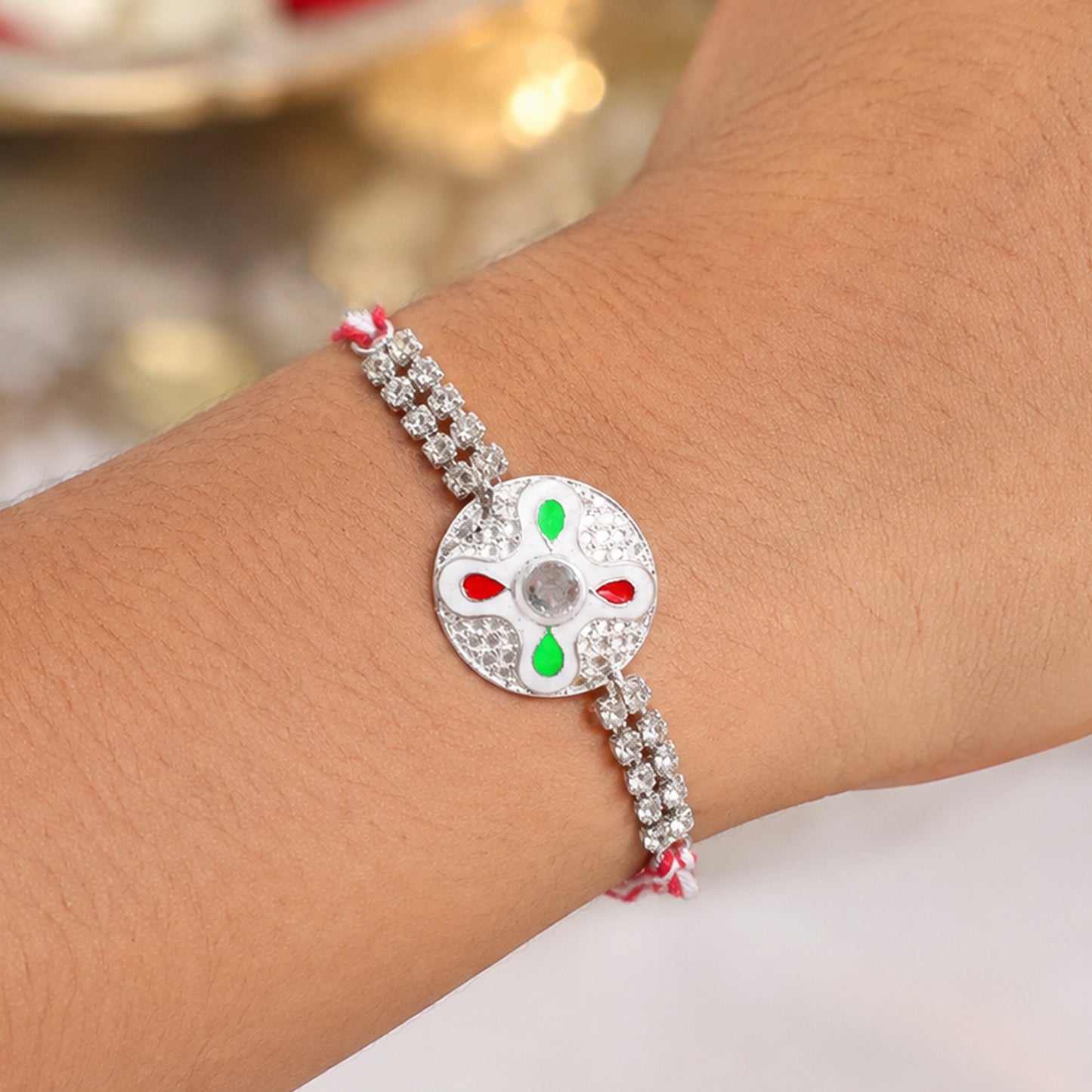 Festive Rakhi featuring Floral Circle Charm, pearl accents and chain look for Gifting
