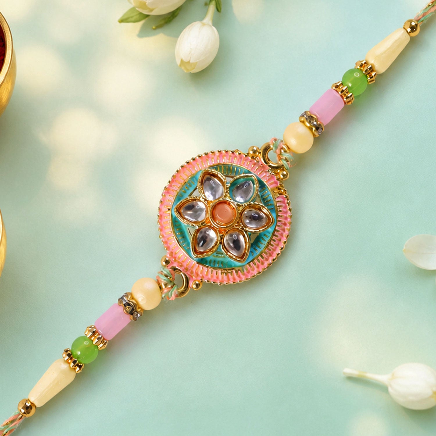 Teal and Pink Round Kundan Pendant Rakhi with Pastel Beads