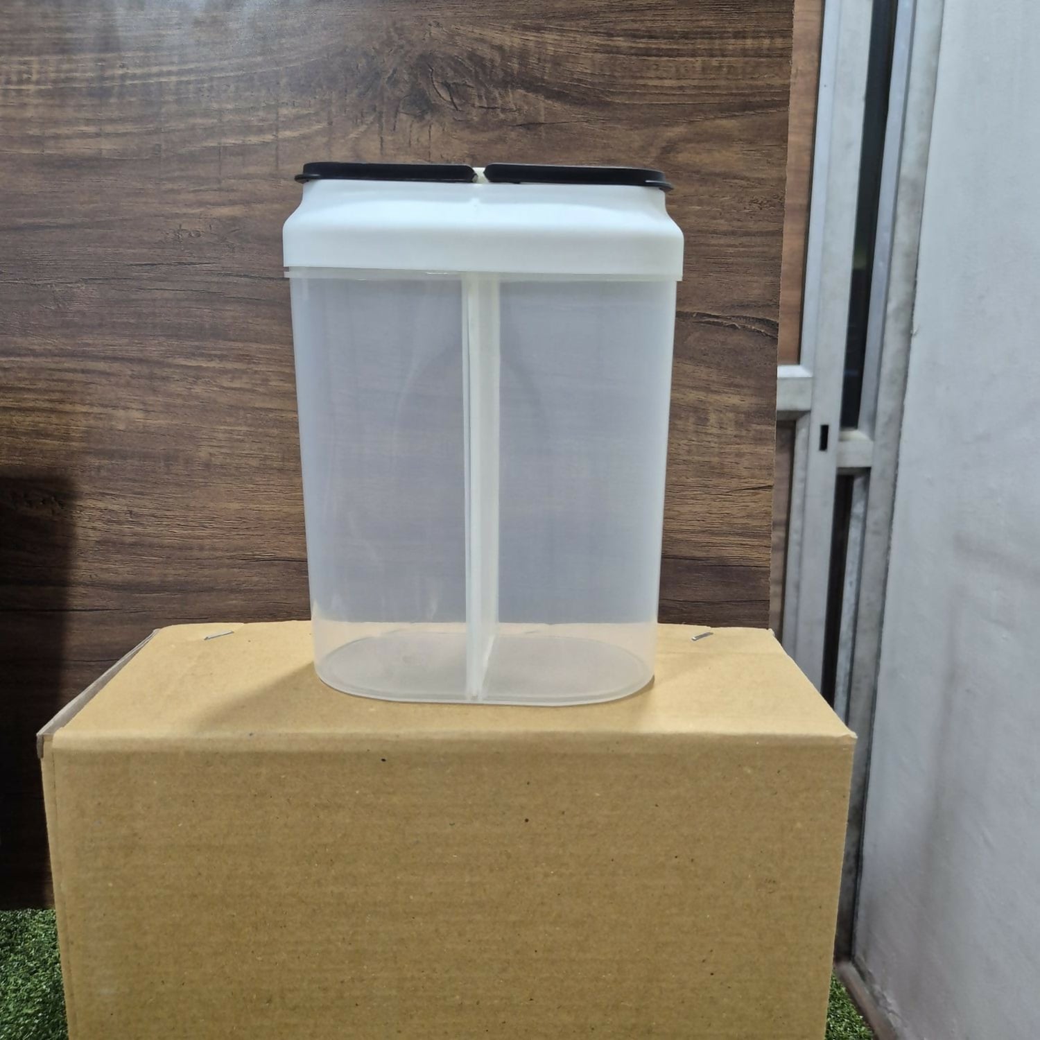 Clear dual compartment container showing internal divider & capacity