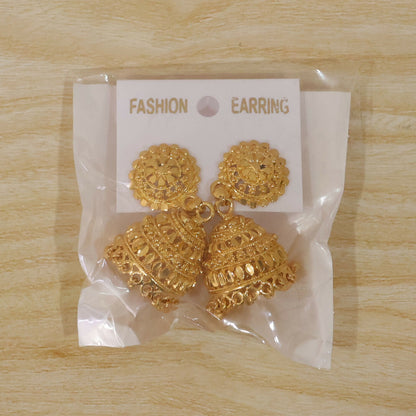 Ornate design on classic gold jhumka earrings with pearls