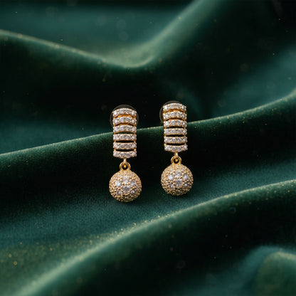 Close-up view of elegant party wear drop earrings with cubic zirconia stones