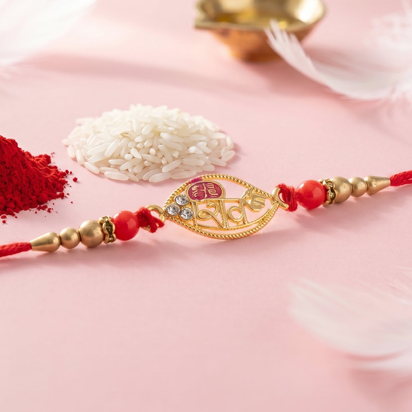 Gold Leaf Shiv Rakhi with Pearl Sides and Red Beads