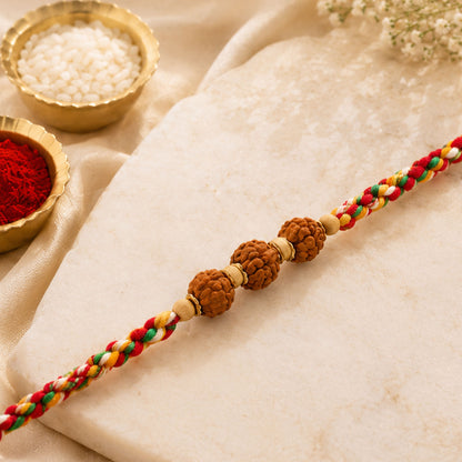 Rudraksha Style Devotional Rakhi with Braided Red Green Yellow Thread and Wooden Beads