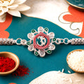 Om Rakhi – Floral Design with Pink Green Accents for Raksha Bandhan