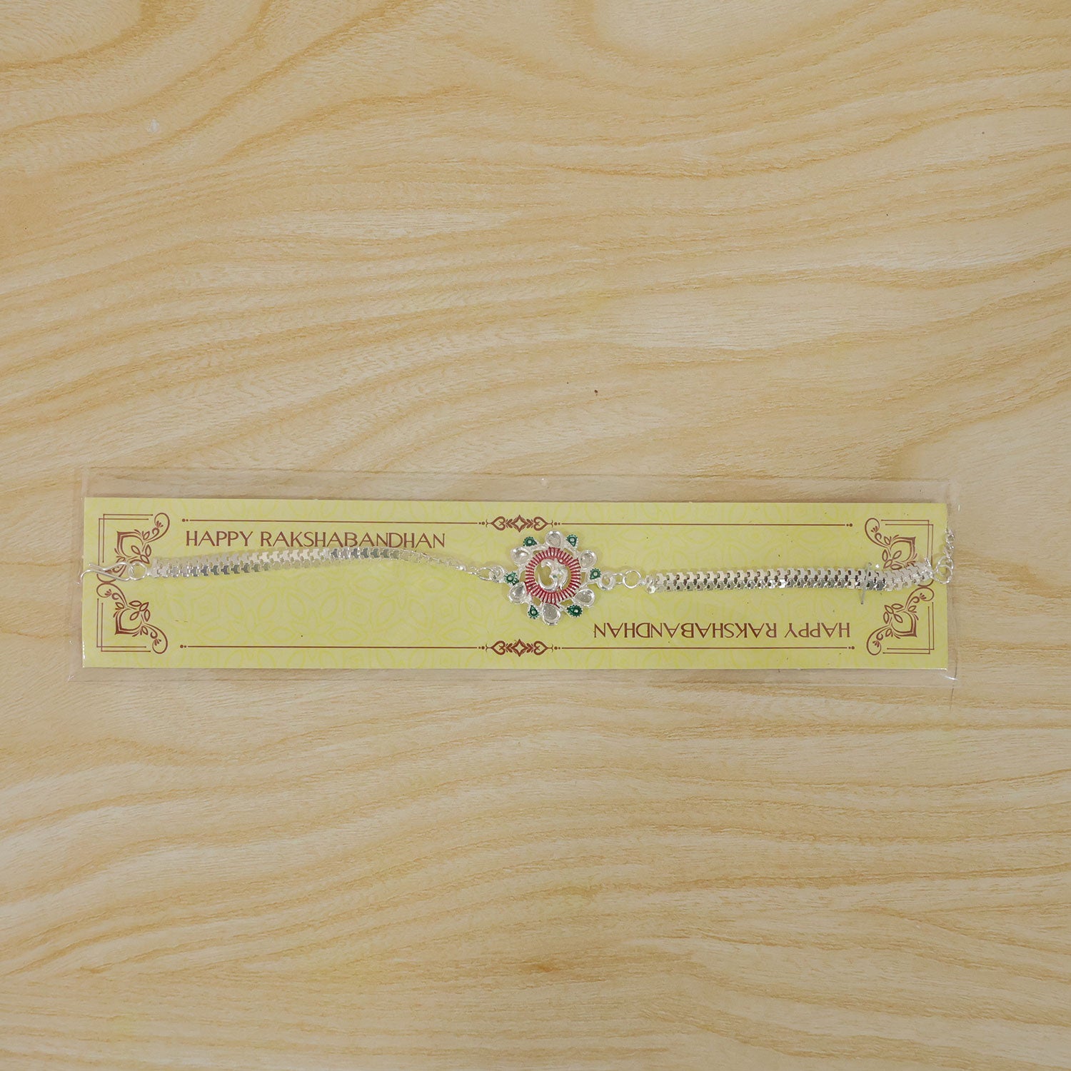 The Om Rakhi presented on a neutral background, ready for gifting during Raksha Bandhan.