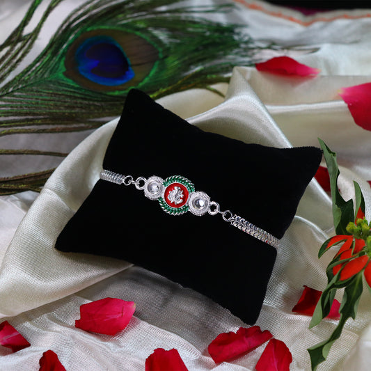 Shiny Silver Rakhi with Ganesha Emblem and Elegant Dual Chain Design