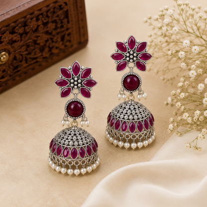 Close-up of delicate lavender bead latkans on traditional oxidized earrings