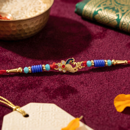 Close-up of Antique Mini Peacock Designer Rakhi centerpiece