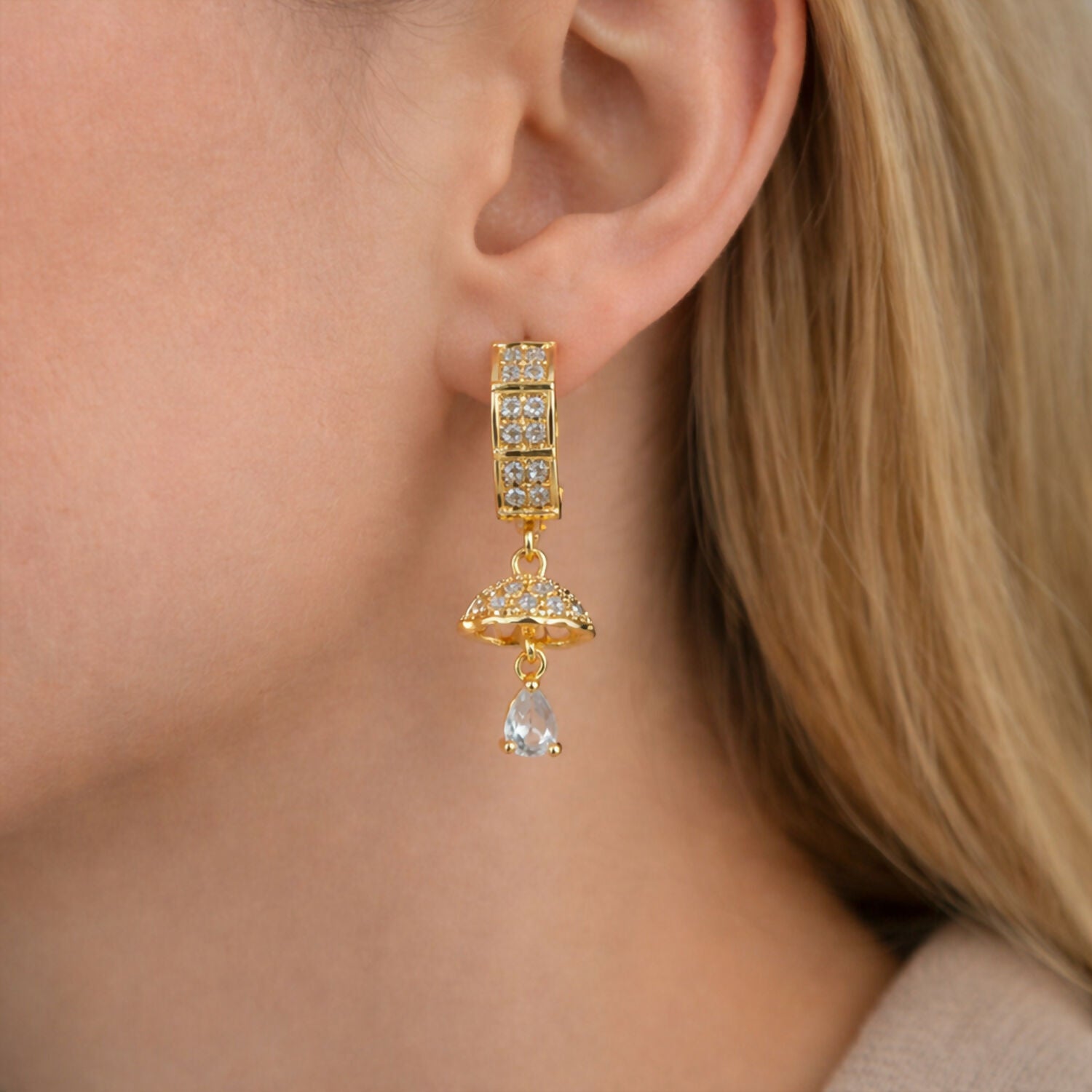 Detailed dome-shaped charm on gold-tone crystal drop earrings for women