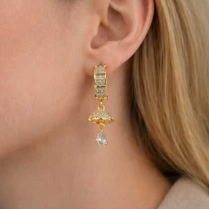 Detailed dome-shaped charm on gold-tone crystal drop earrings for women
