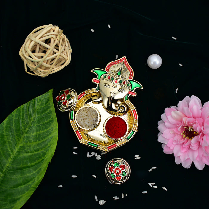 Green And Red Flower Rakhi With Ganesha Pooja Thali Set ,Silver Color Pooja Coin, Roli Chawal & Greeting Card