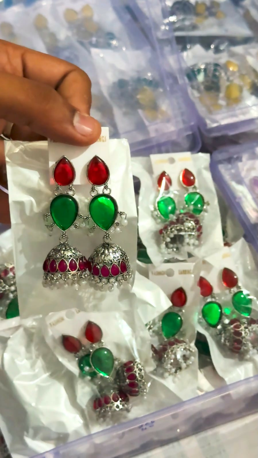 Detailed view of the craftsmanship of oxidised silver jhumka earrings