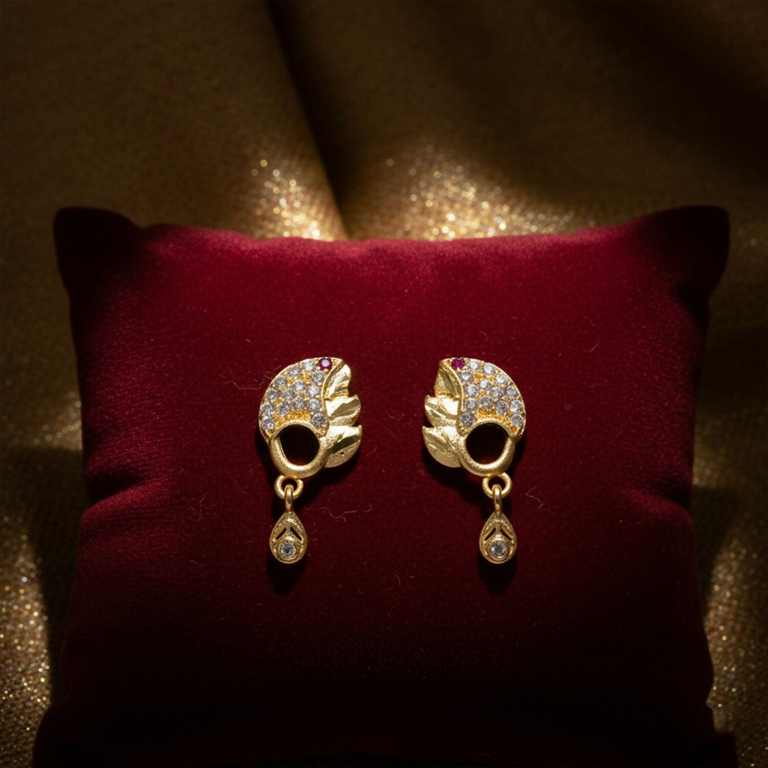 Elegant Gold Finish Leaf Pattern Stud Earrings With Sparkling Stone Drop Design