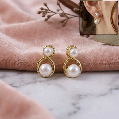 Close-up of Korean pearl infinity stud earrings on white background