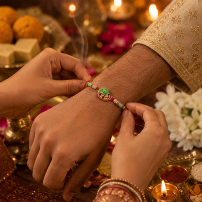 Close-up of Mini Krishna Peacock Leaf design on Rakhi