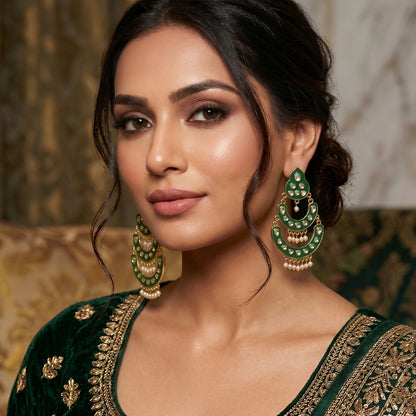 Close-up of golden chain design and stone work on earrings