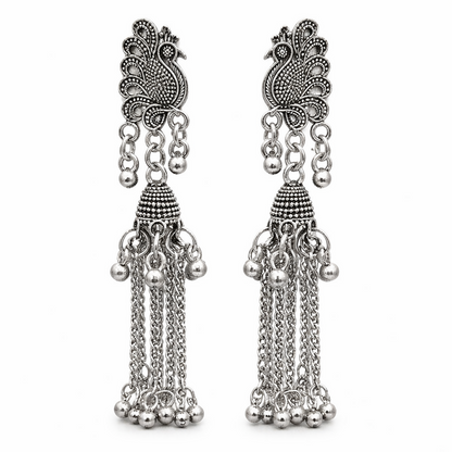 Side angle of oxidised peacock jhumka earrings with chain tassels