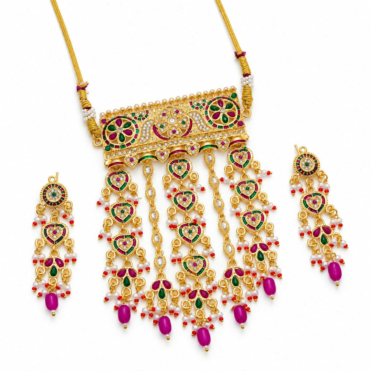 Golden-tone choker necklace and matching earrings with ornate rectangular pendant and heart-shaped drops, displayed on a