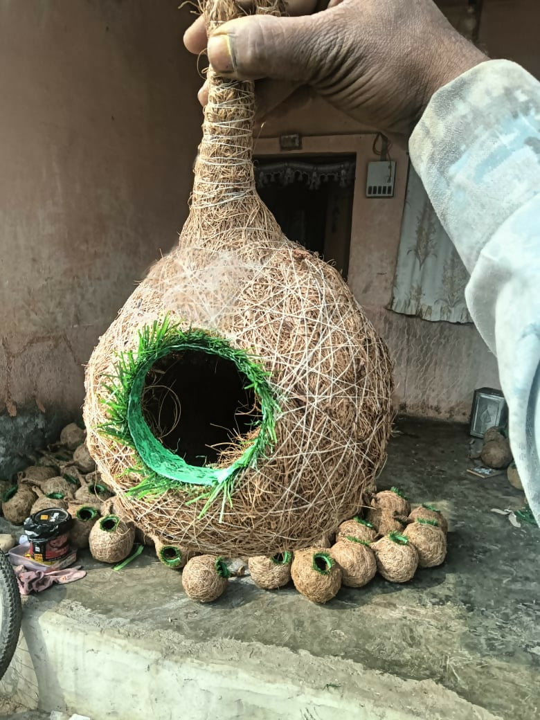 Eco-friendly bird nest suspended outdoors in garden