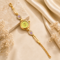 Elegant Gold-Tone Bracelet Watch with Pastel Yellow Dial and Purple Heart Accents
