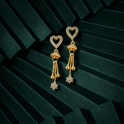Side view of romantic rose gold heart dangle earrings with flowing tassels