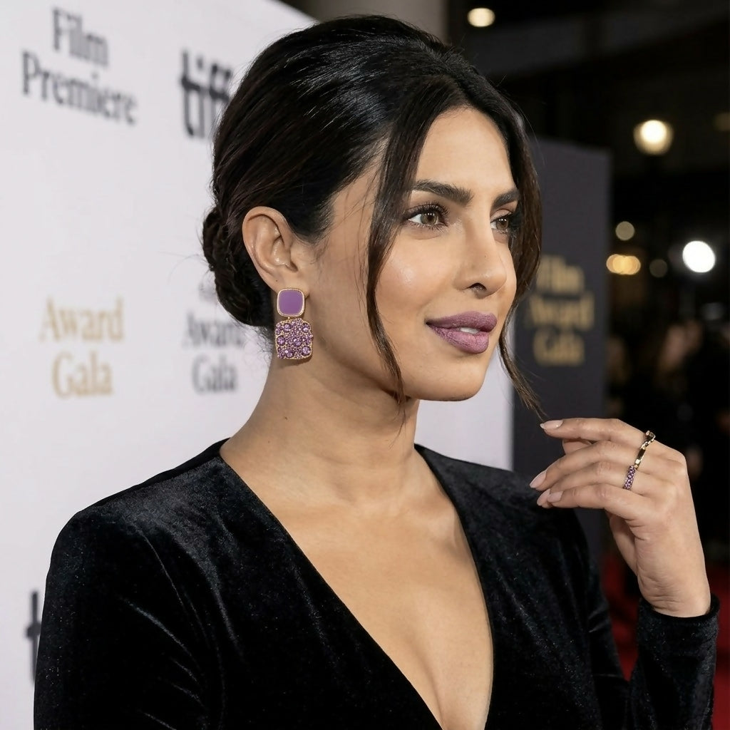 Priyanka Chopra Jonas wearing purple crystal and enamel square drop earrings, looking to her right at an event.