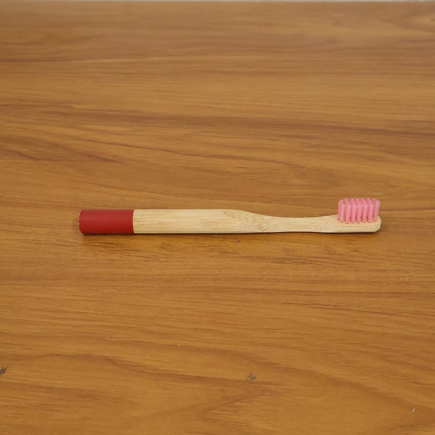 Lifestyle image of bamboo toothbrush in bathroom