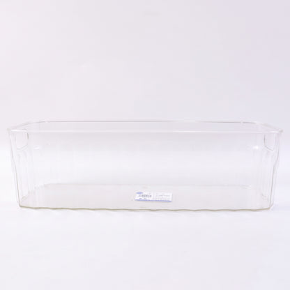 Decorative ribbed sides on a transparent storage basket for kitchen organization.