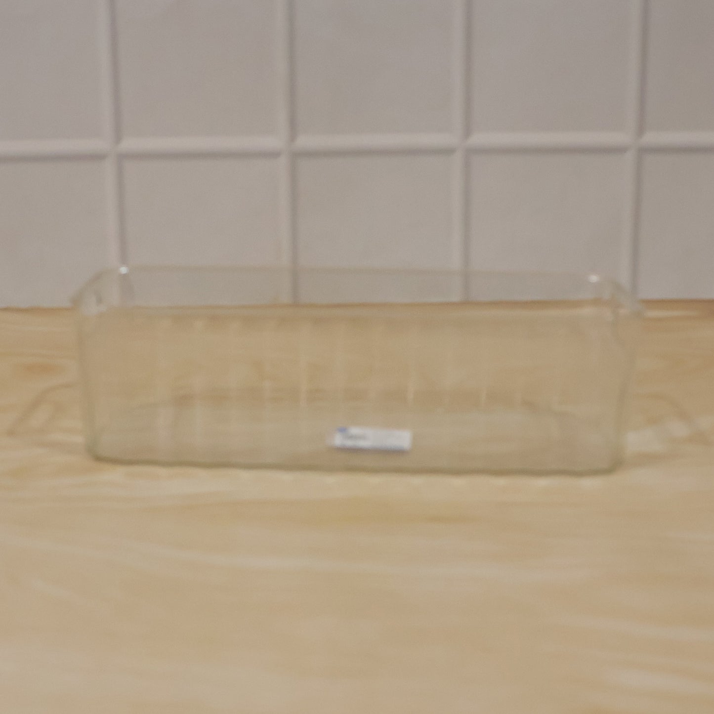 Easy-to-clean plastic basket for pantry and fridge organization.