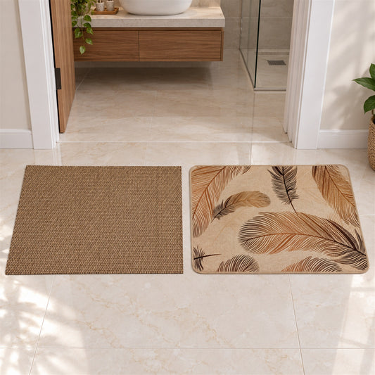 Two rectangular floor mats on a light tiled floor, one brown textured, the other beige with feather designs.