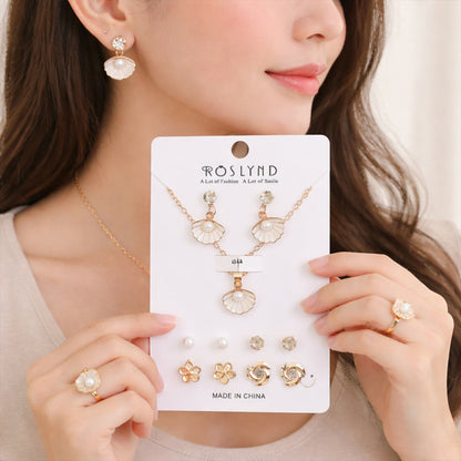 Close-up of shell pearl stud earrings with gold-plated finish in the jewelry set