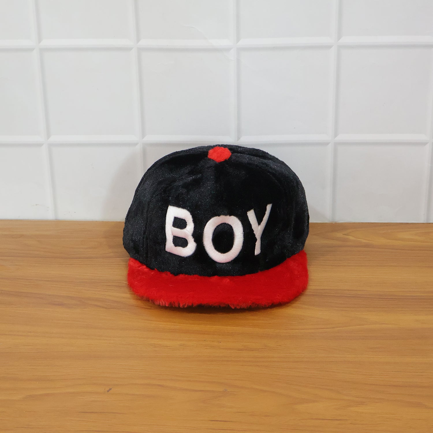 Lifestyle image of boys printed cap