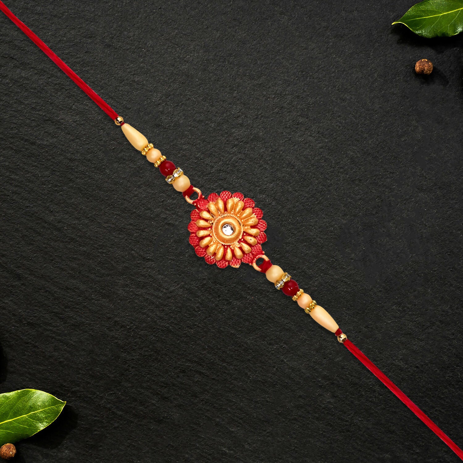 Floral bead rakhi displayed with traditional decorations