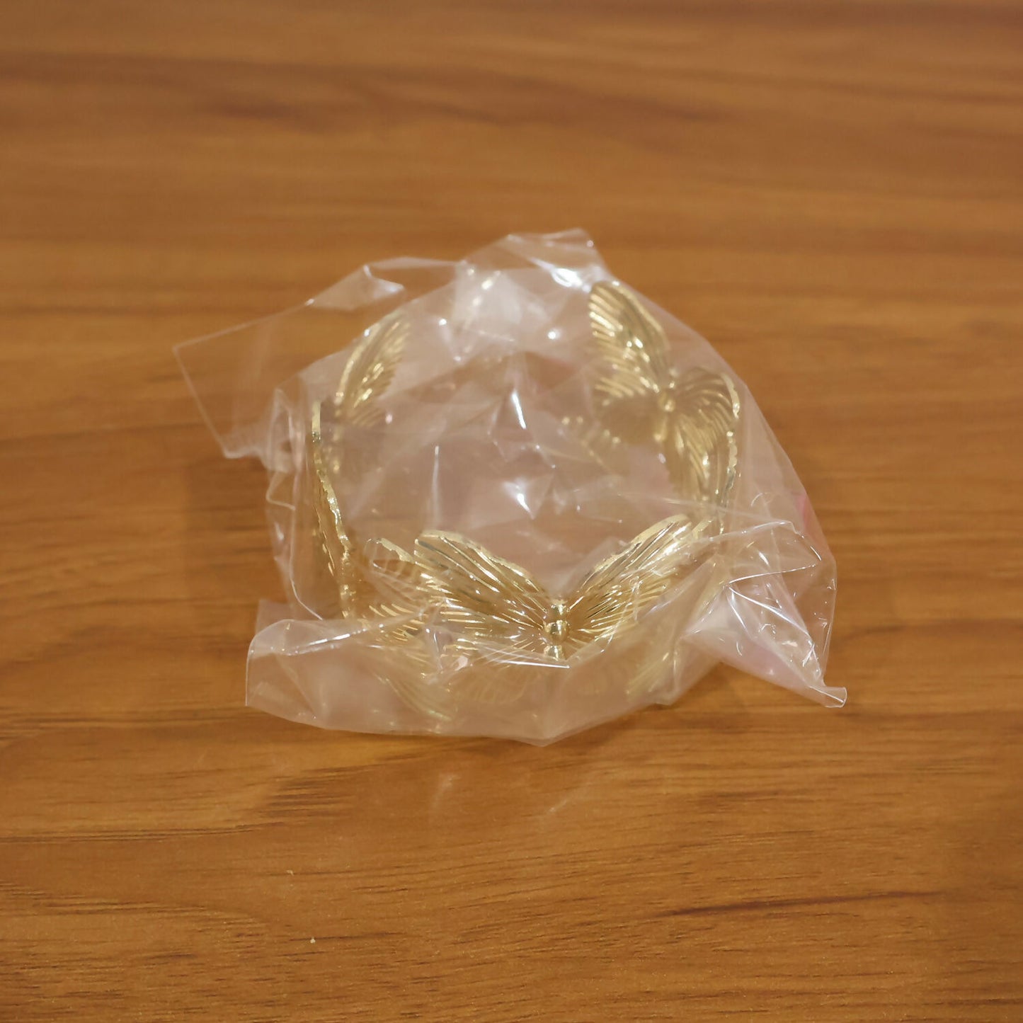 Elegant Korean floral bracelet with gold finish displayed