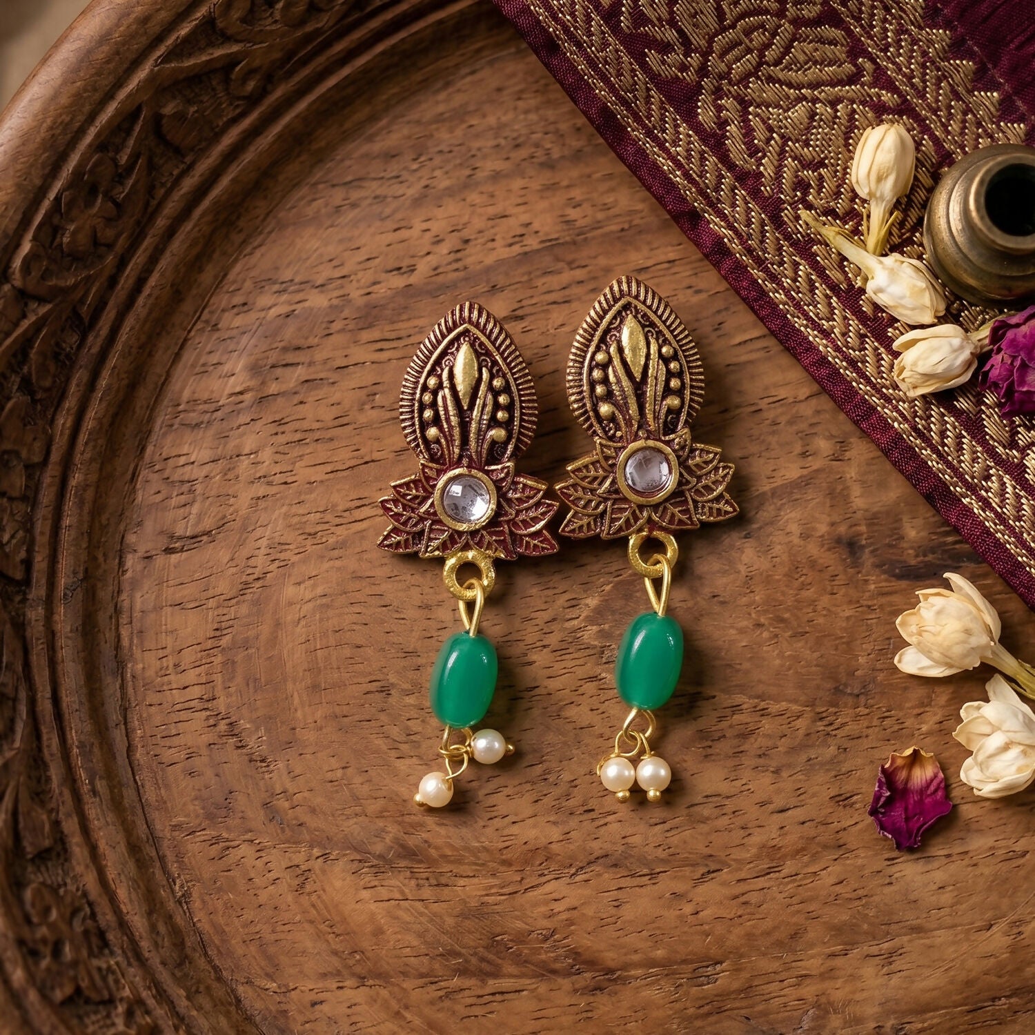 Matching earrings in maroon bead design