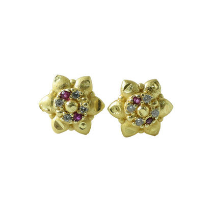 Sparkling decorative stones on traditional floral gold stud earrings