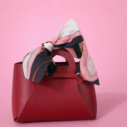 Maroon mini handbag with ribbon bow side view
